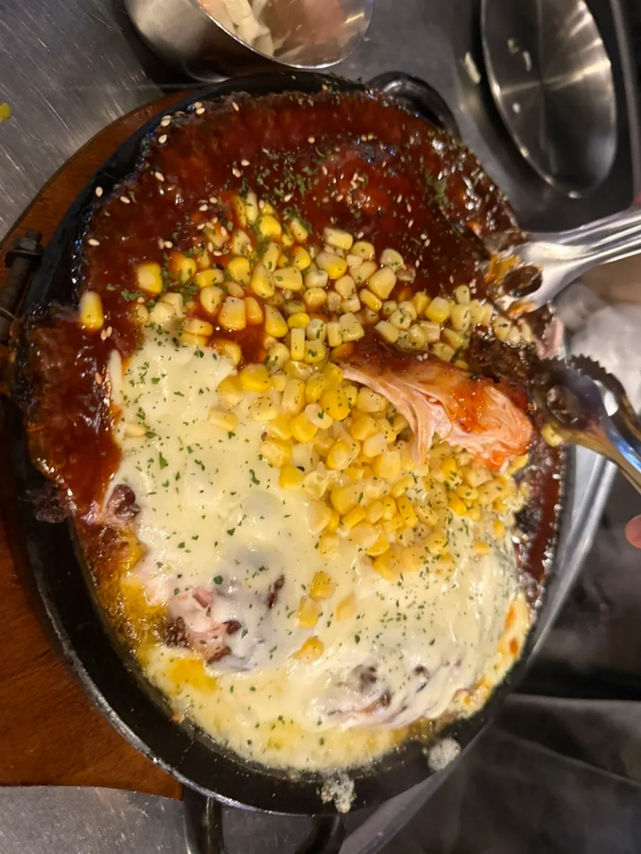 Nurungji chicken served half cheese, half sauce