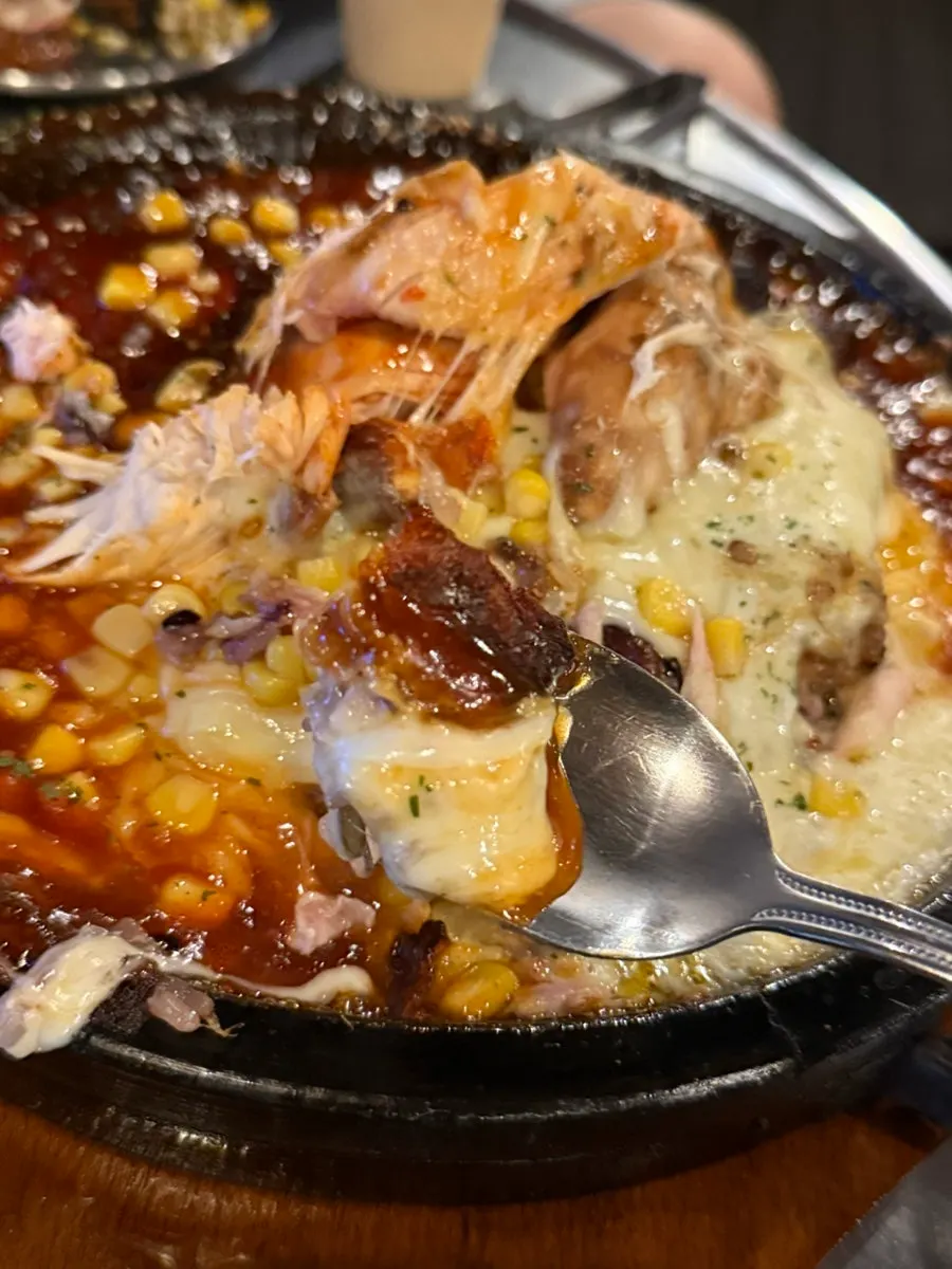 Moist chicken dipped in sauce