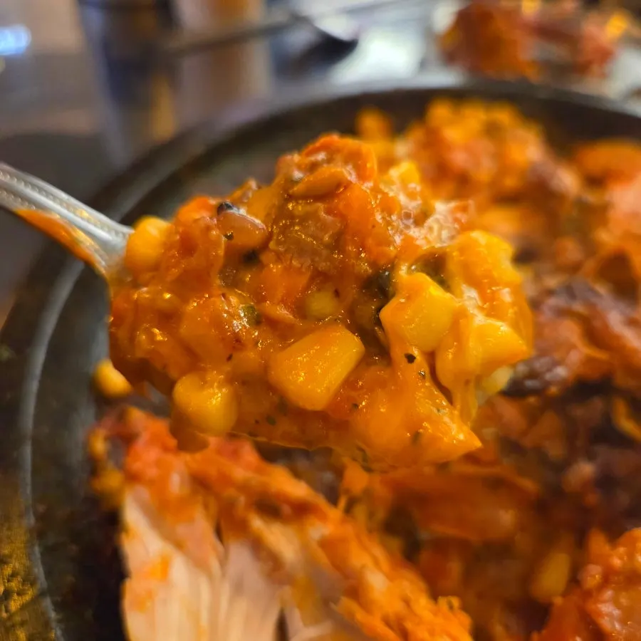Chicken meat coated in rosé sauce