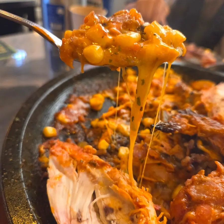 Plate of served rosé scorched-rice chicken
