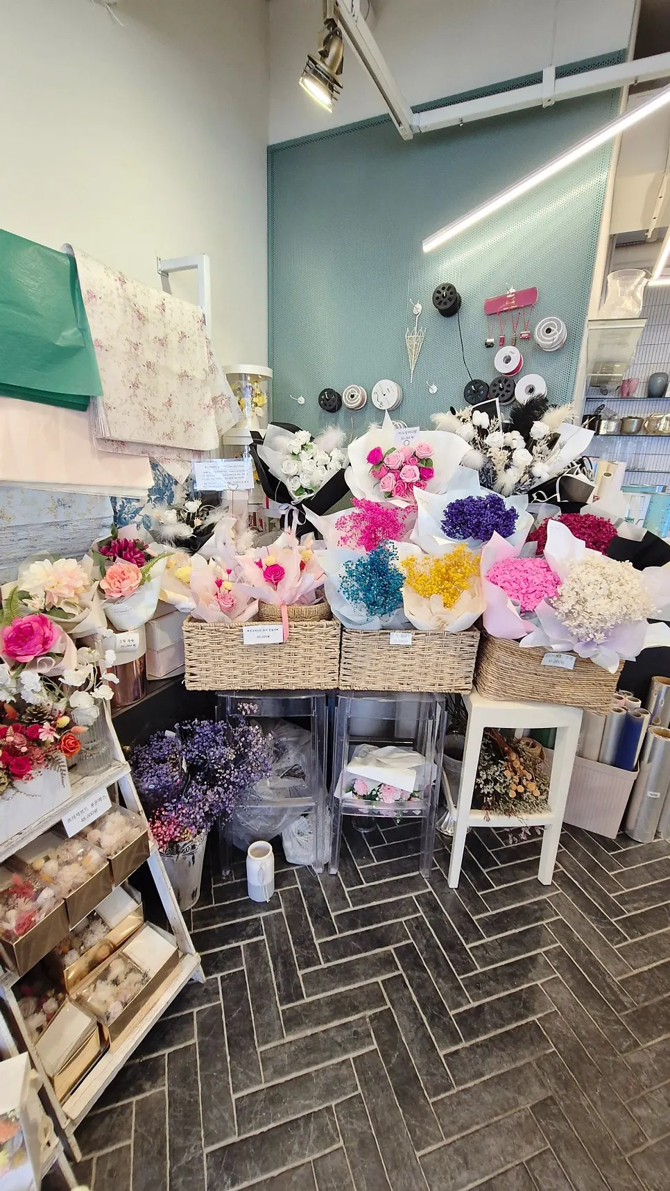 Various flower gift sets displayed in the store