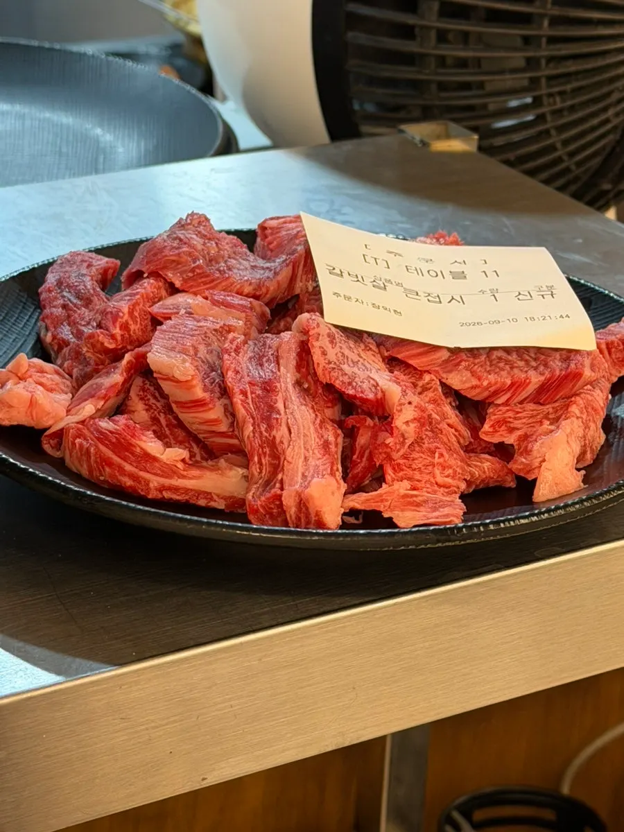 Hanwoo galbitsal grilling over charcoal