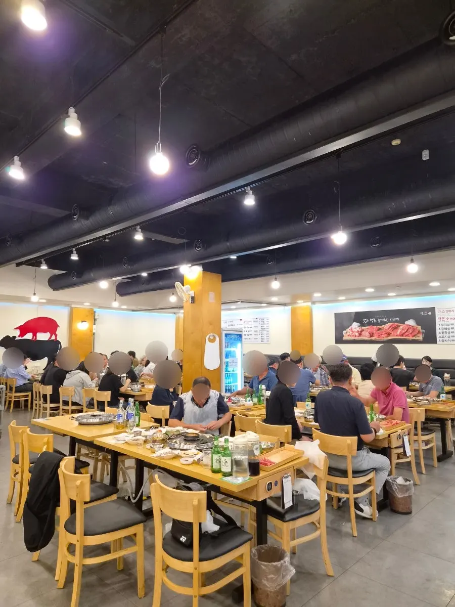 Spacious interior of the Jangan-dong Korean BBQ restaurant with many seats