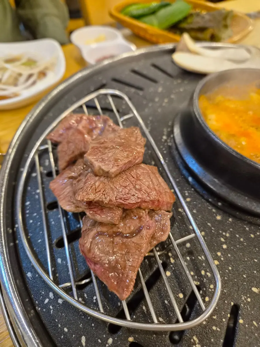 Close-up of beef grilling to doneness