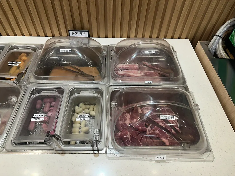 Seasoned pork and chicken from the self-serve bar
