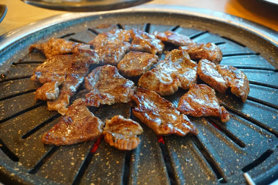 Beef sirloin grilling on the tabletop grill