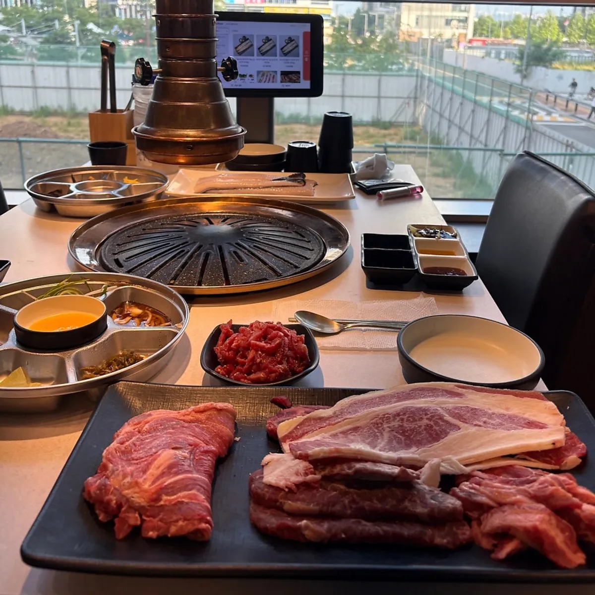 Table set with beef, eel, and yukhoe