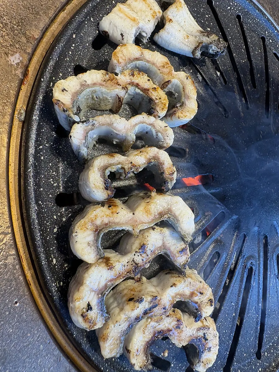 Plump eel placed on the grill