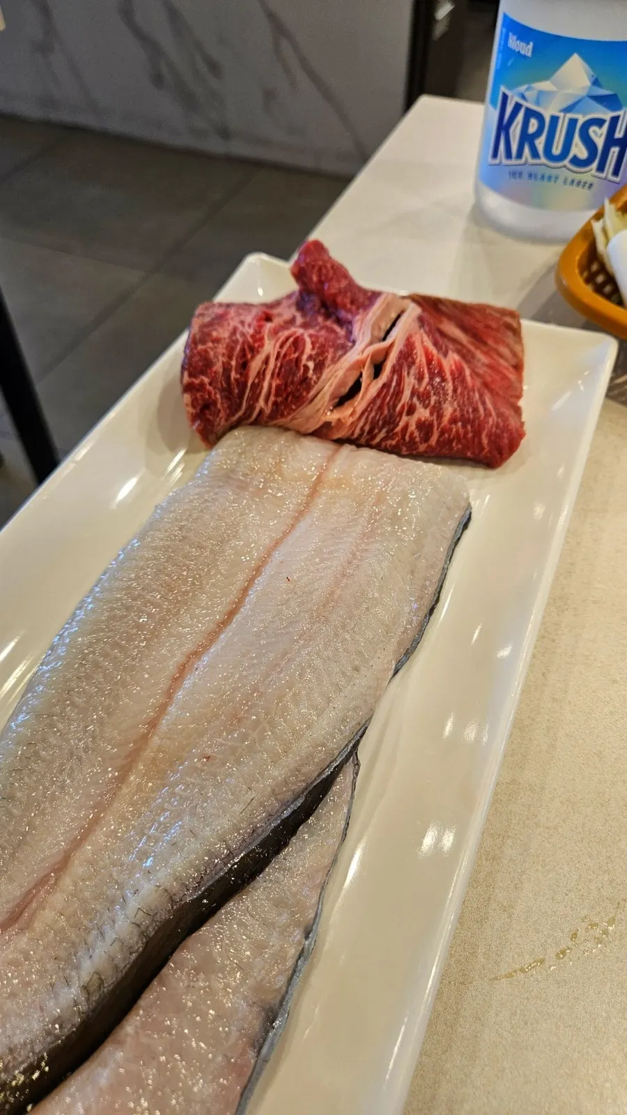 First serving of eel and sirloin delivered by serving robot