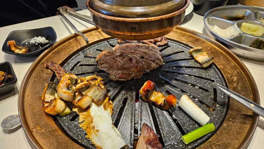 Beef sirloin cooking on the grill