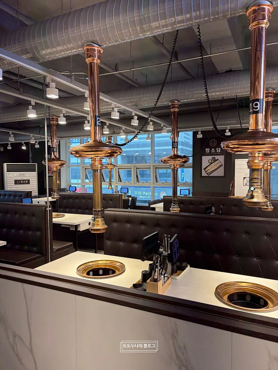 Interior of Jangsodam Yeongjong Direct Store with generous table spacing