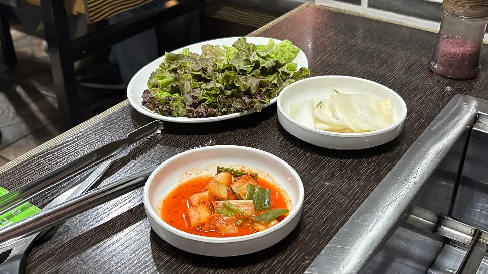 Chive salad and pickled perilla leaves among the side dishes