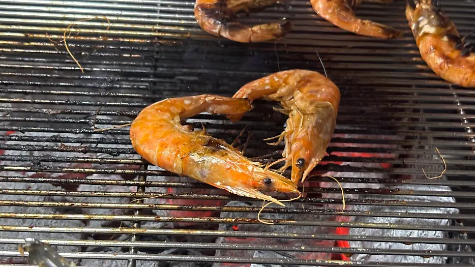 Six king prawns on the charcoal grill