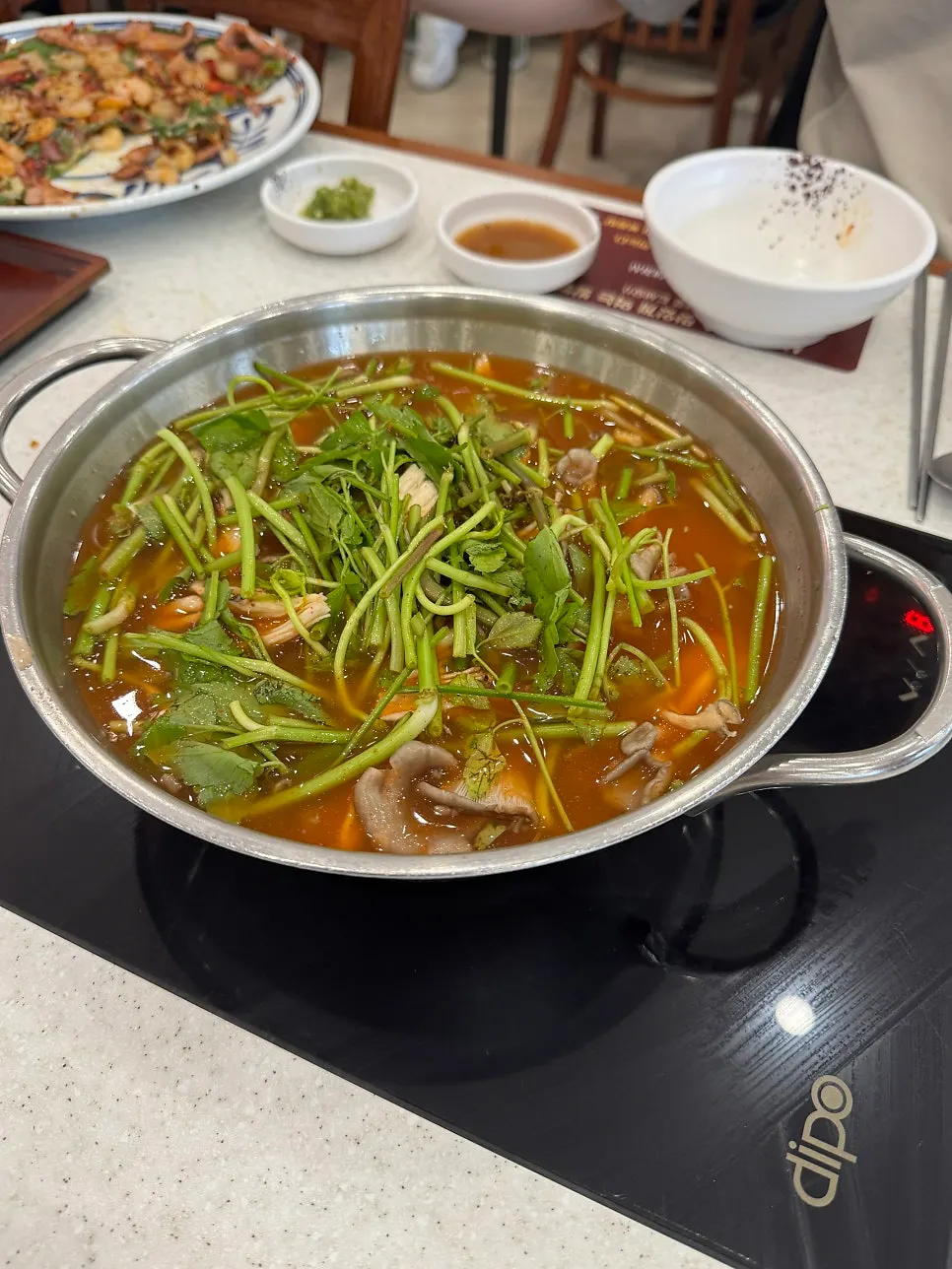 Blanching chadol brisket in boiling red broth