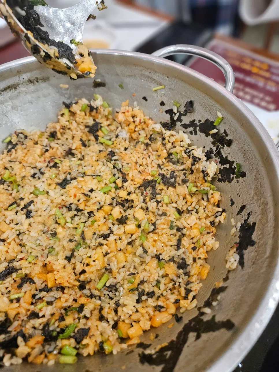 A bowl of freshly fried perilla oil kkakdugi fried rice
