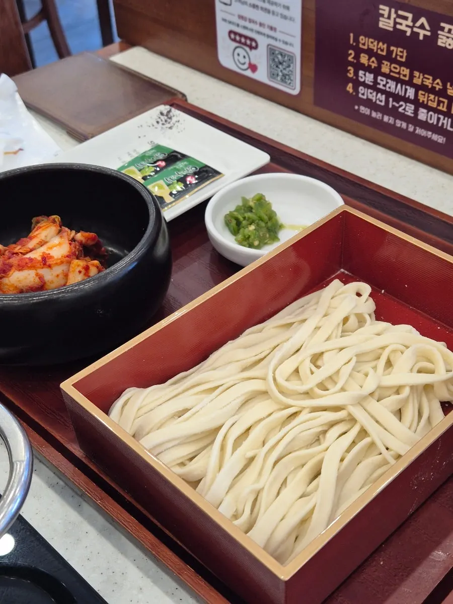 House-made fresh noodles stretching without breaking