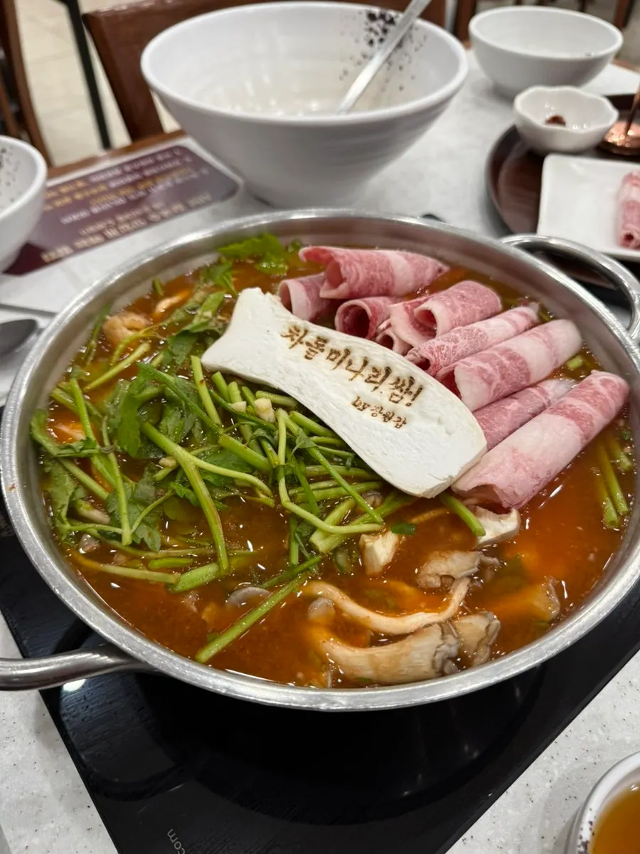 Table spread of chadol minari-ssam shabu kalguksu