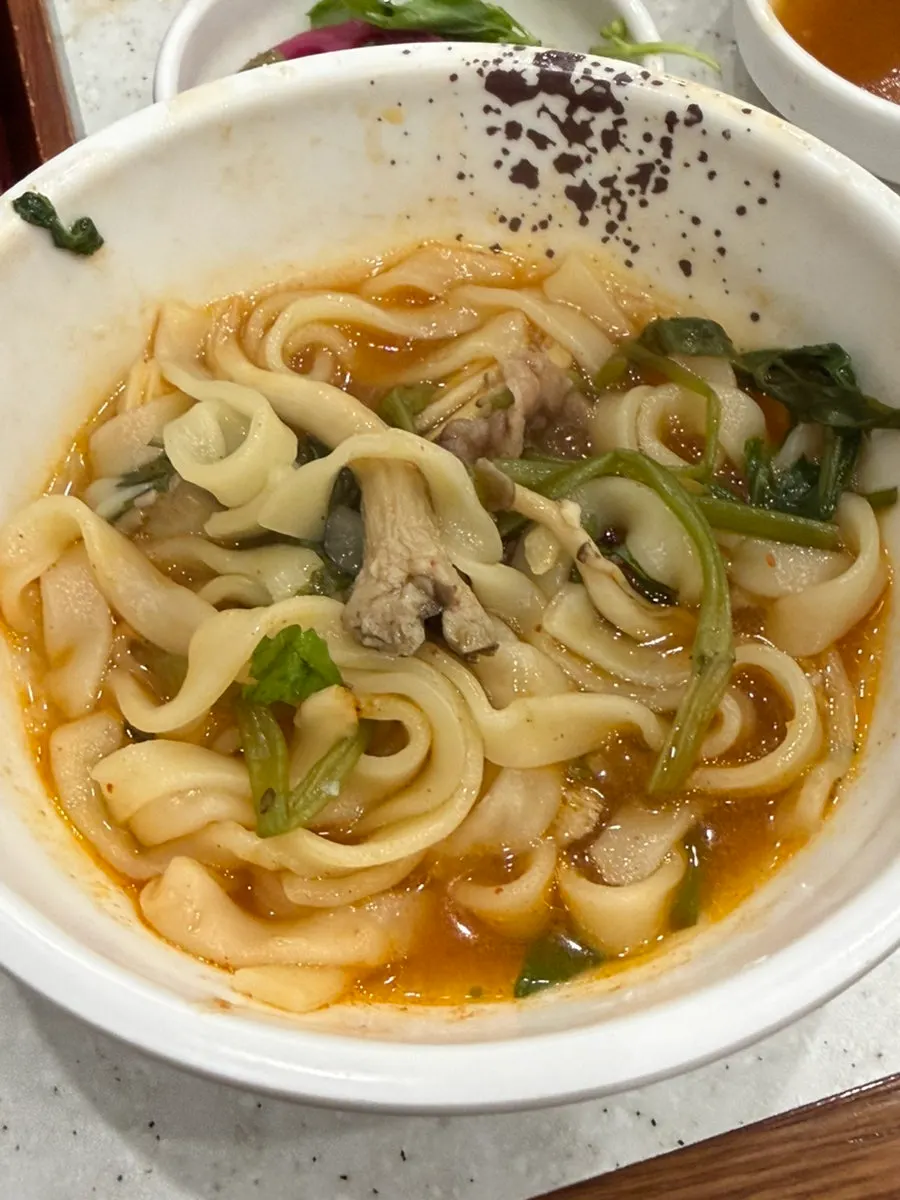 Uiseong garlic kimchi placed on top of noodles