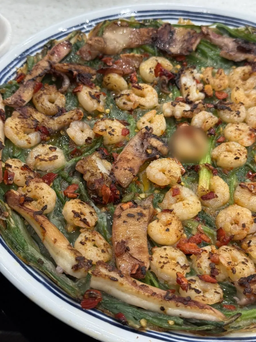 Cross-section of the pancake filled with shrimp and squid
