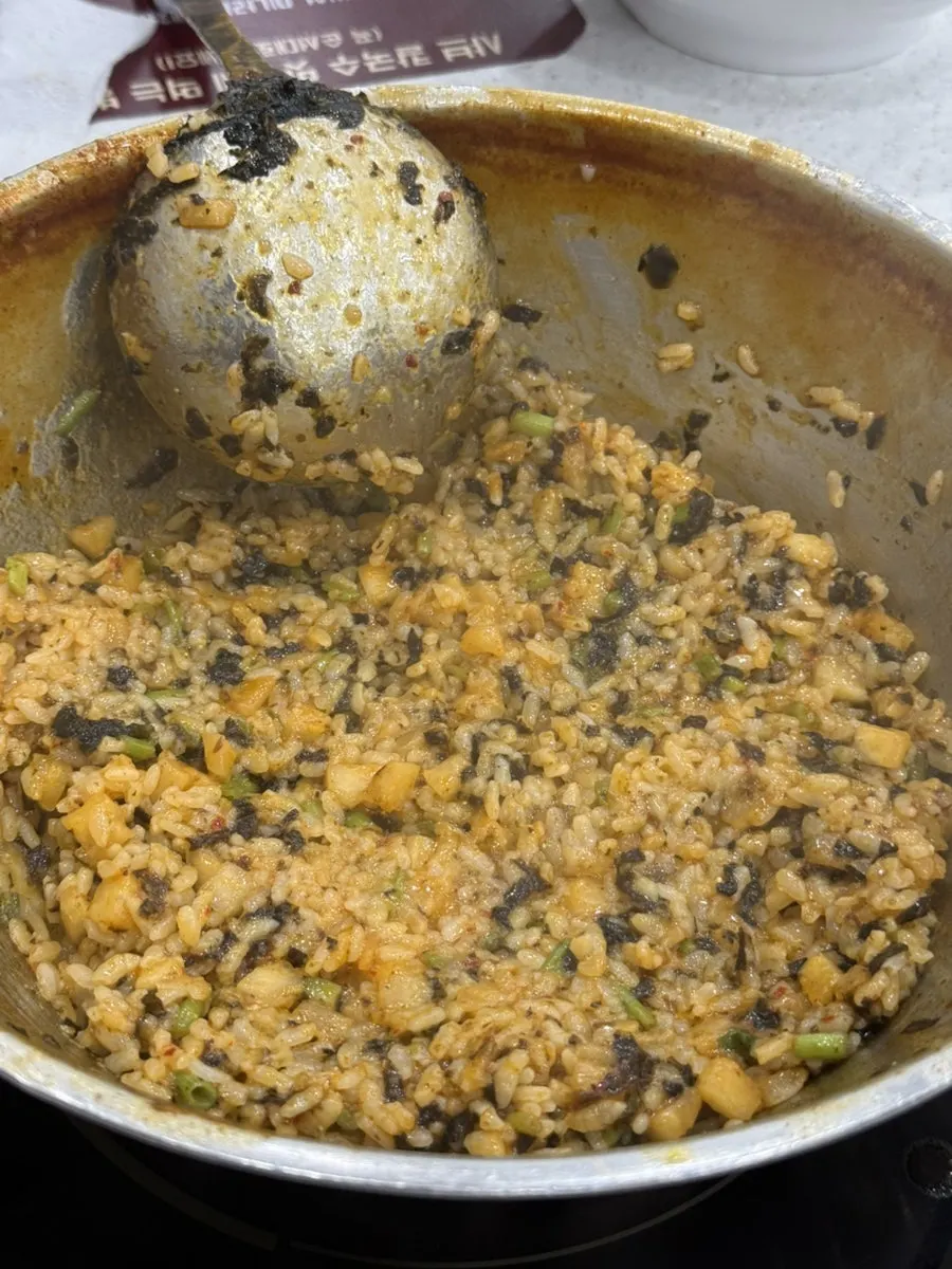 Fried rice scraped clean to the bottom of the pot