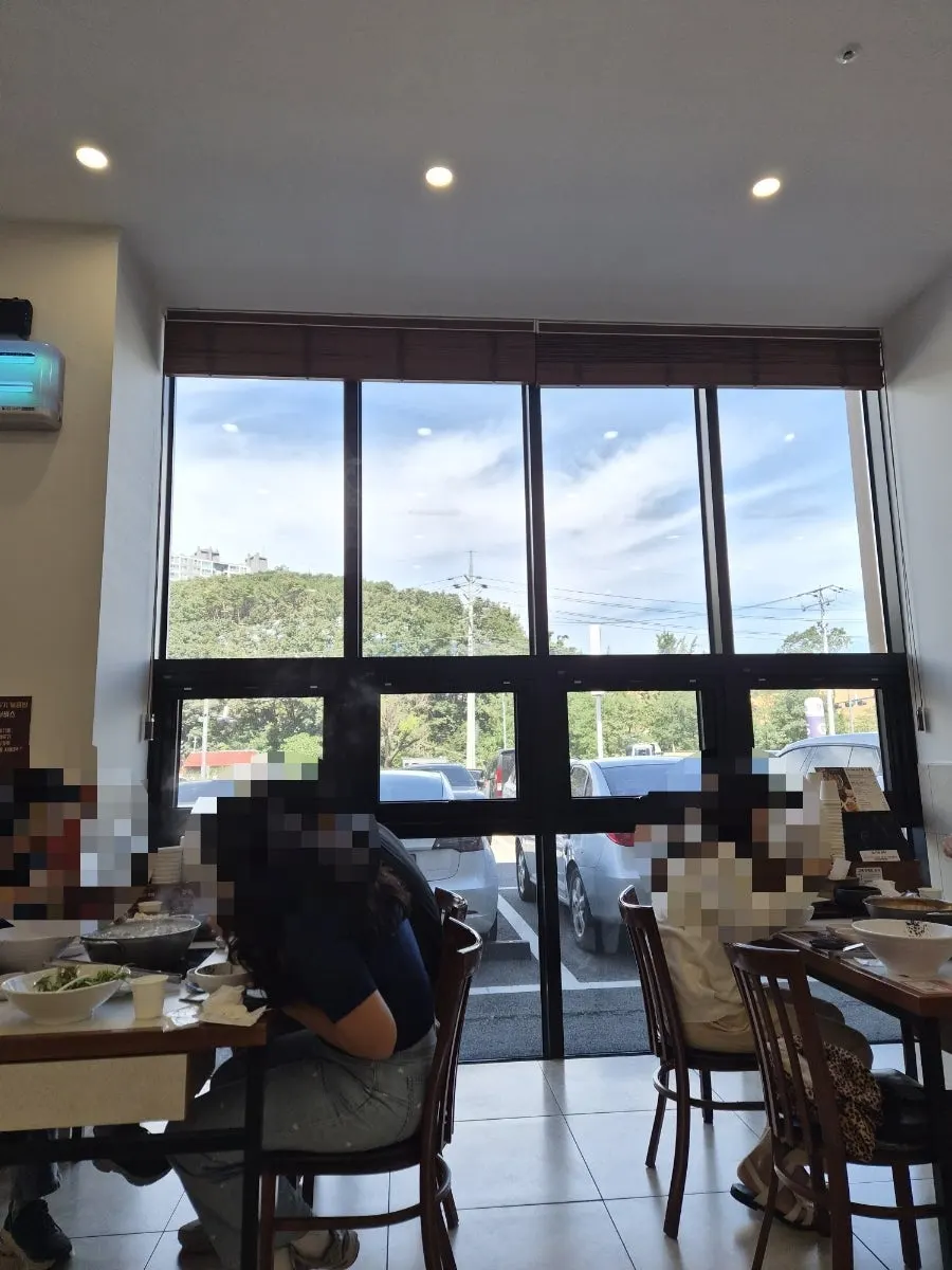 Interior wall with a sign about their house-made noodles