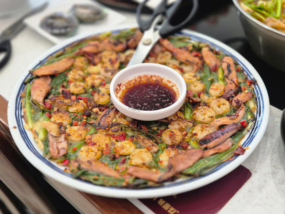A plate of whole shrimp seafood pancake