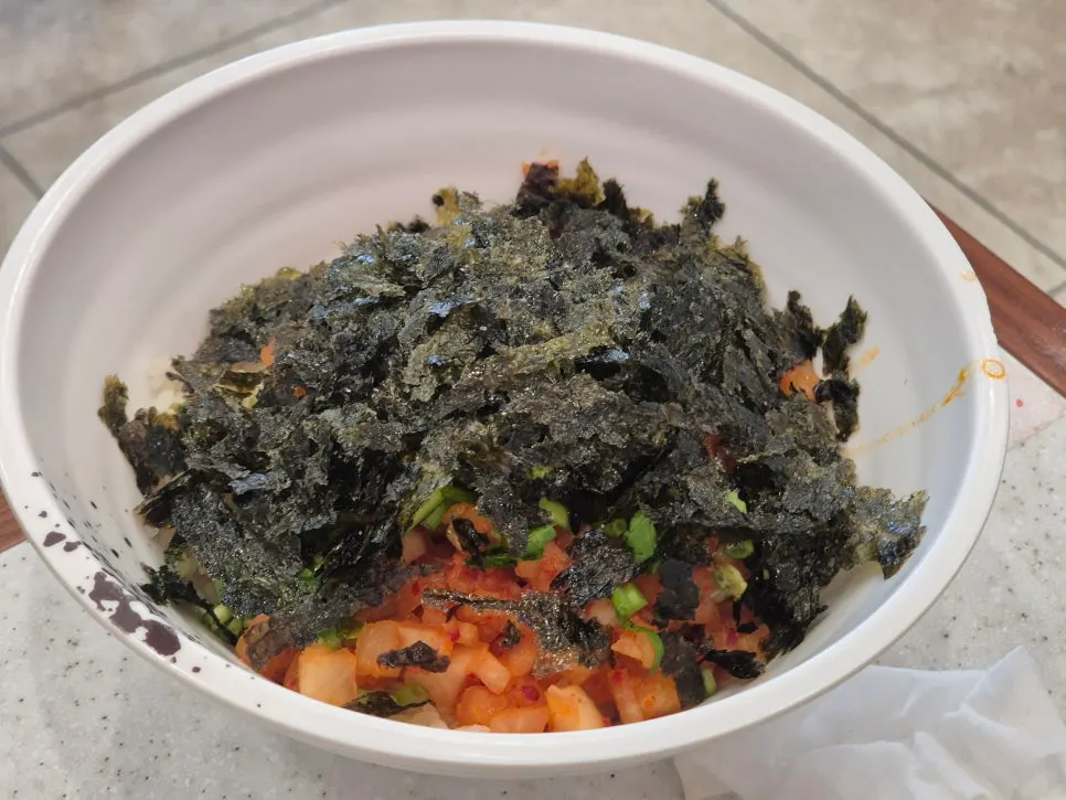 Kalguksu noodles topped with Uiseong garlic kimchi