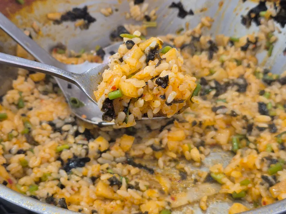 Perilla oil kkakdugi fried rice topped with seaweed flakes