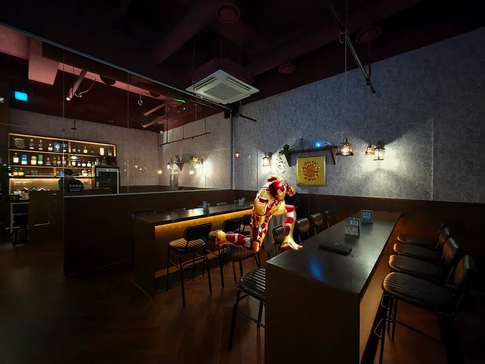 Janhyang's bar space lit with toned-down indirect lighting