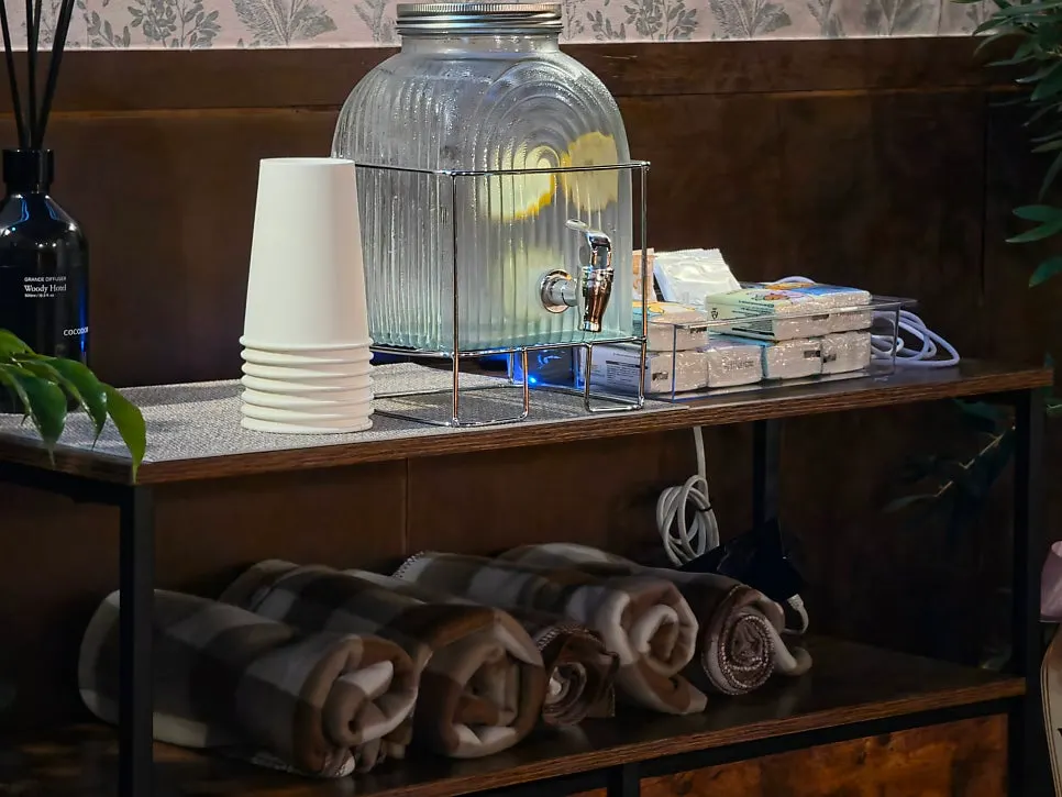 Lap blanket and amenities set out on a table