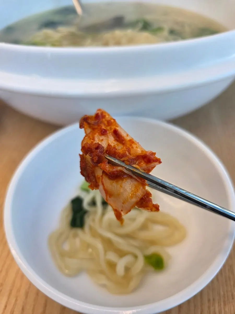 Kimchi served alongside the kalguksu