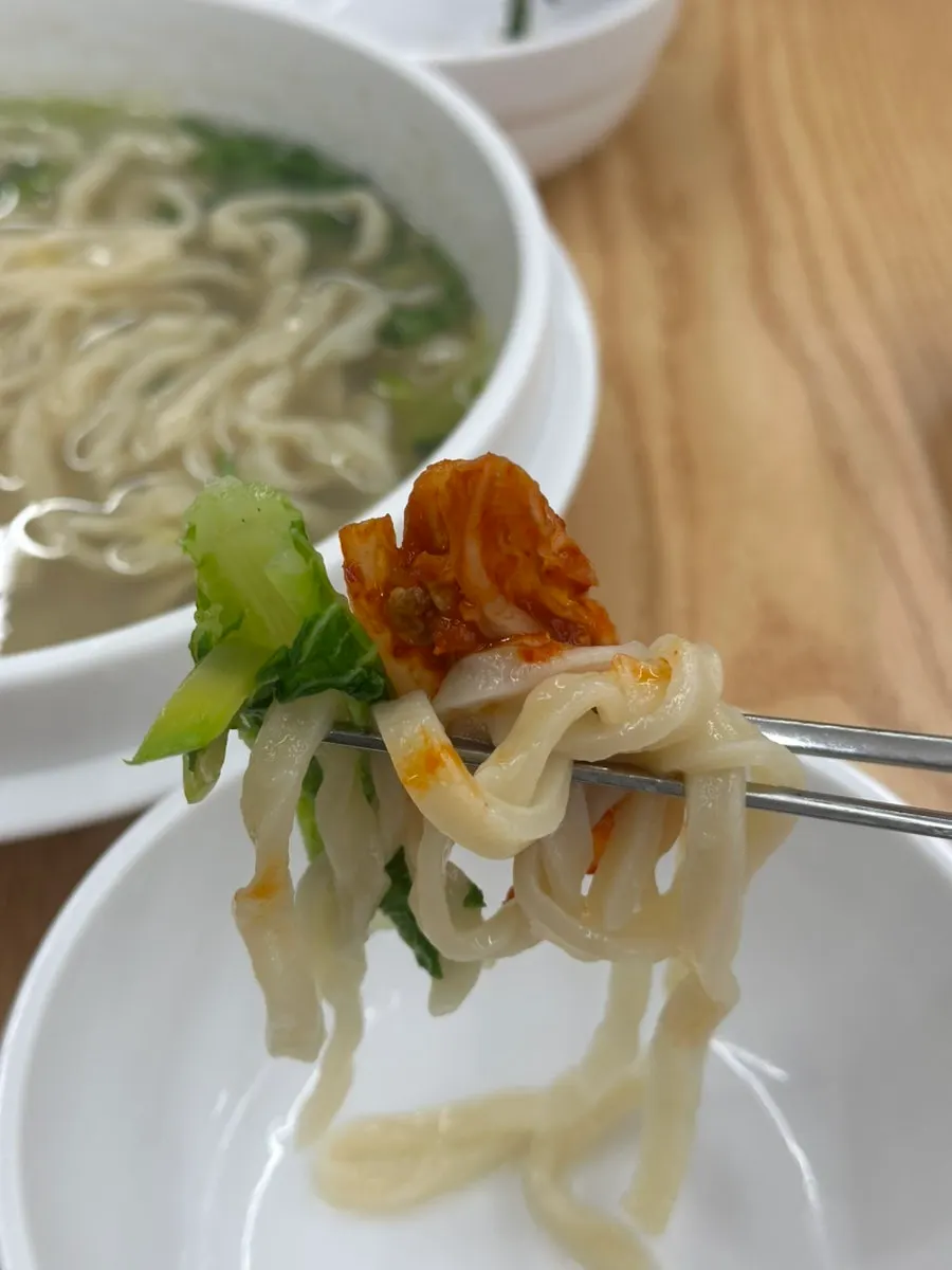 Noodles lifted up with chopsticks