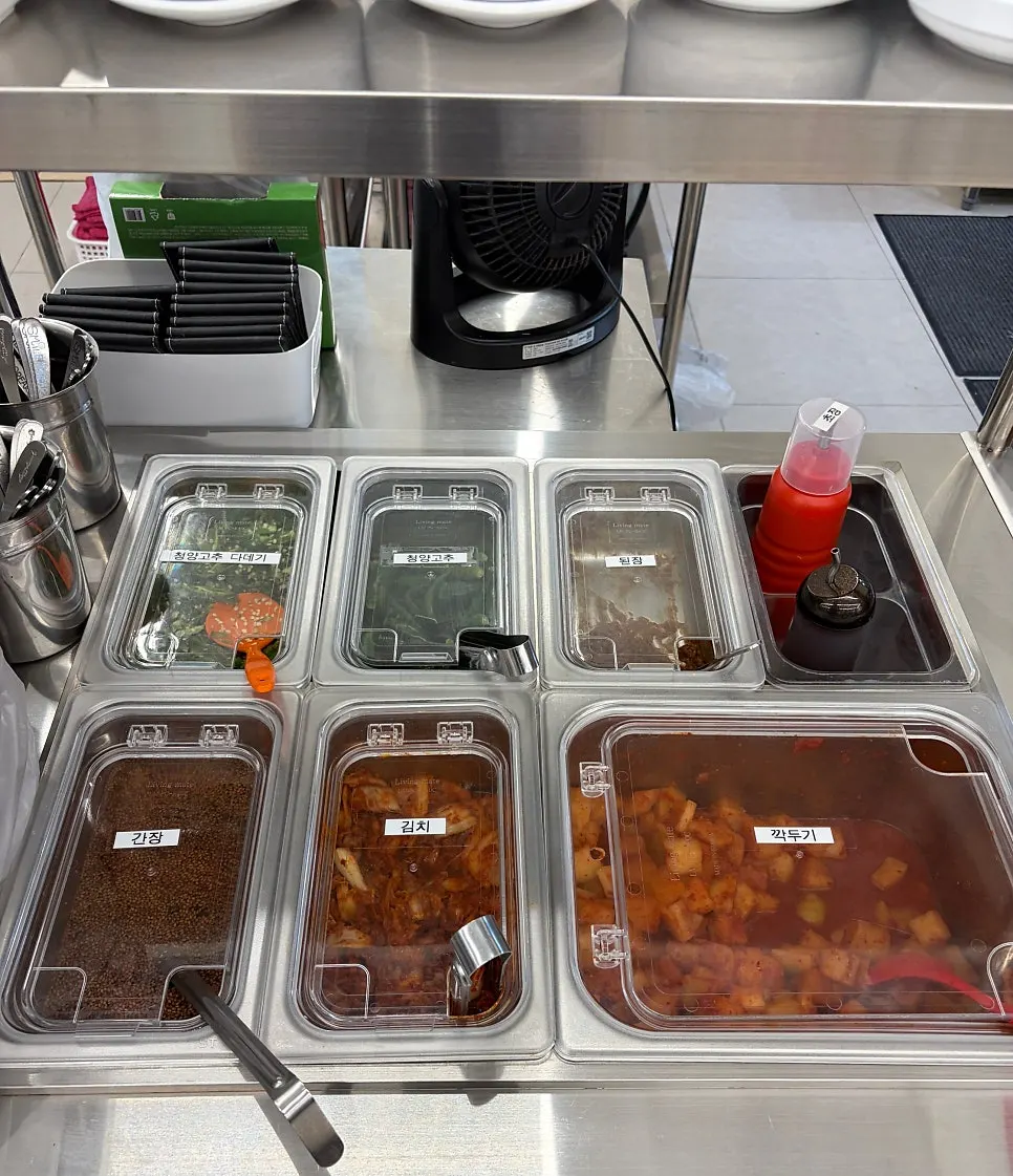 Self-serve bar with side dishes and sauces