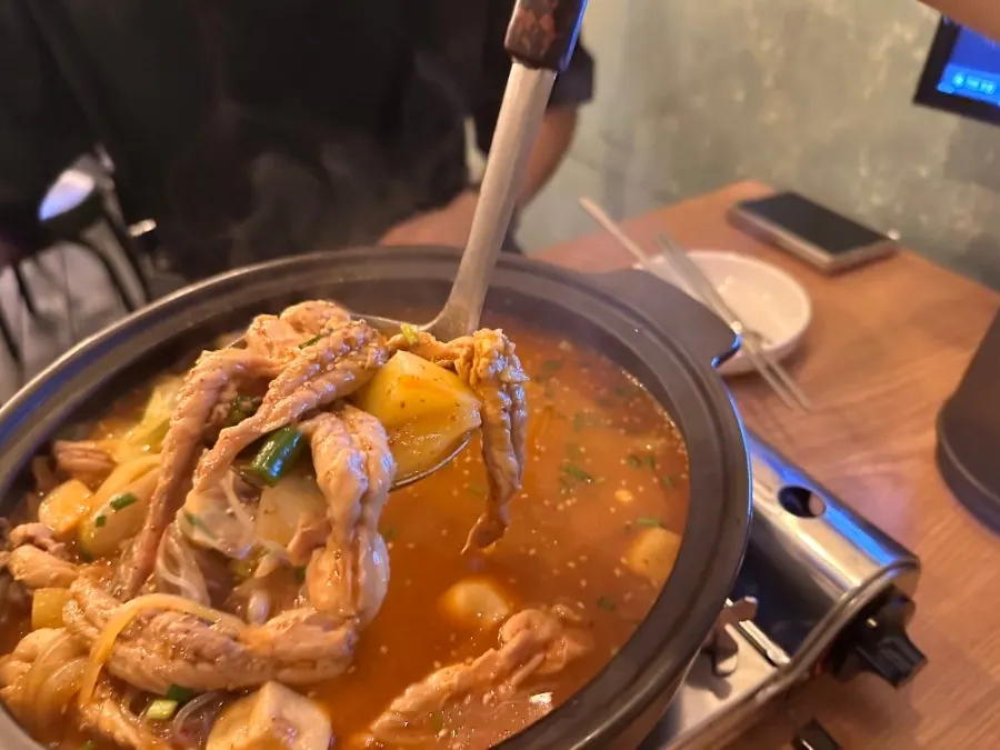 Chicken neck meat lifted out of the mokdori-tang