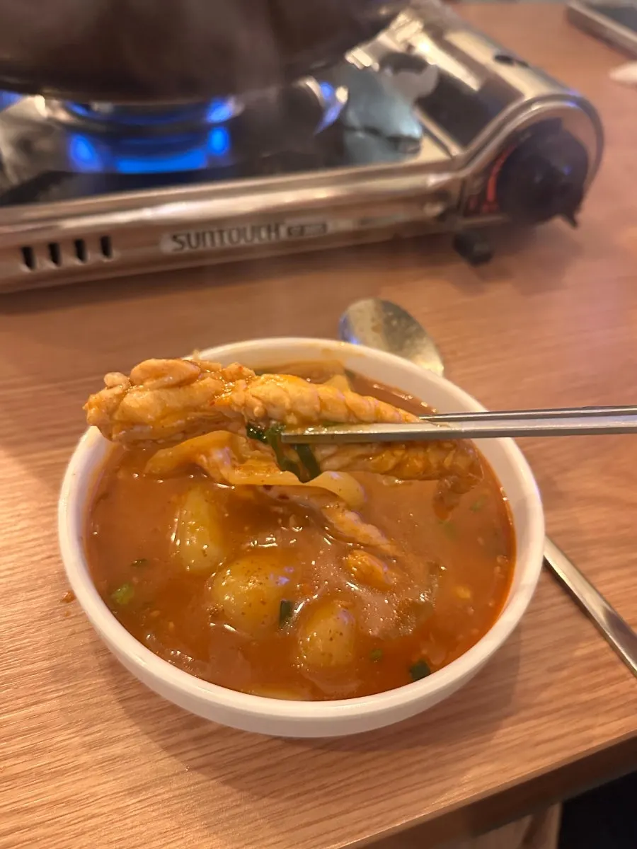 Vertical shot of the seasoned mokdori-tang broth