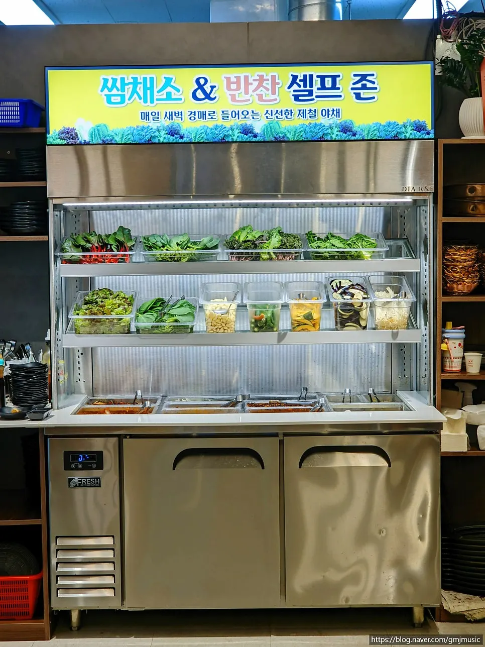 Self-serve zone with wrap greens and side dishes