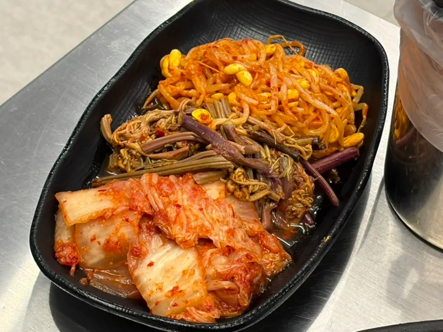 Self-serve vegetable bar with eggplant for grilling
