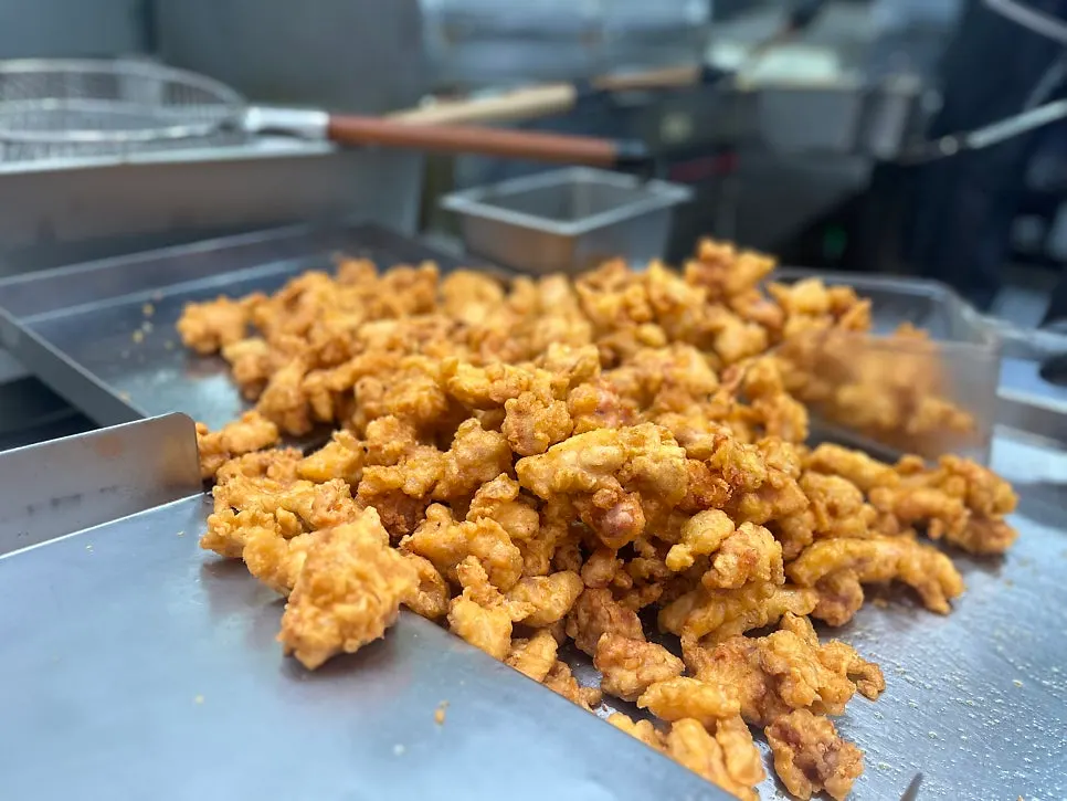 Whole fried chickens displayed in the shop