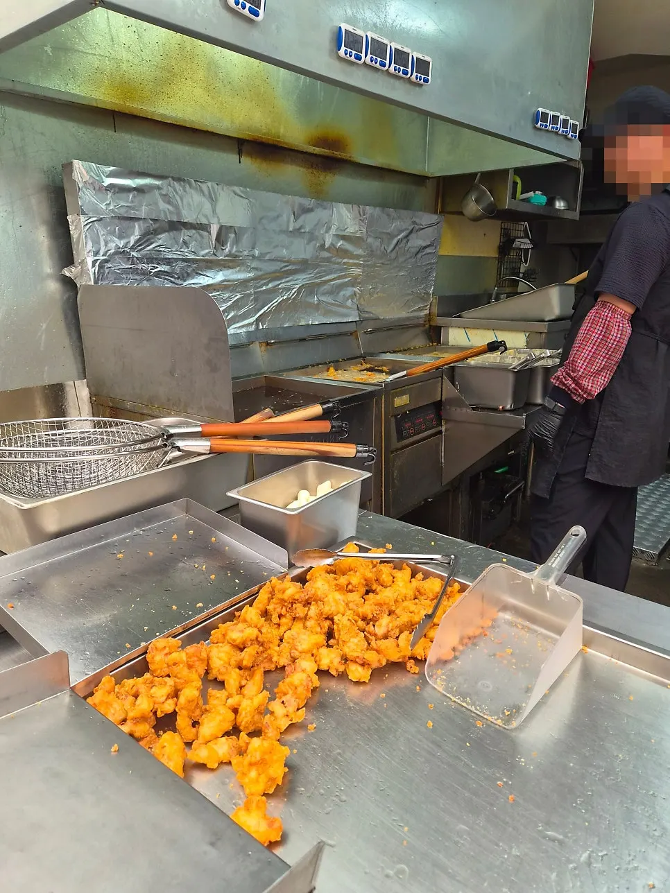Storefront with customers picking up takeout chicken