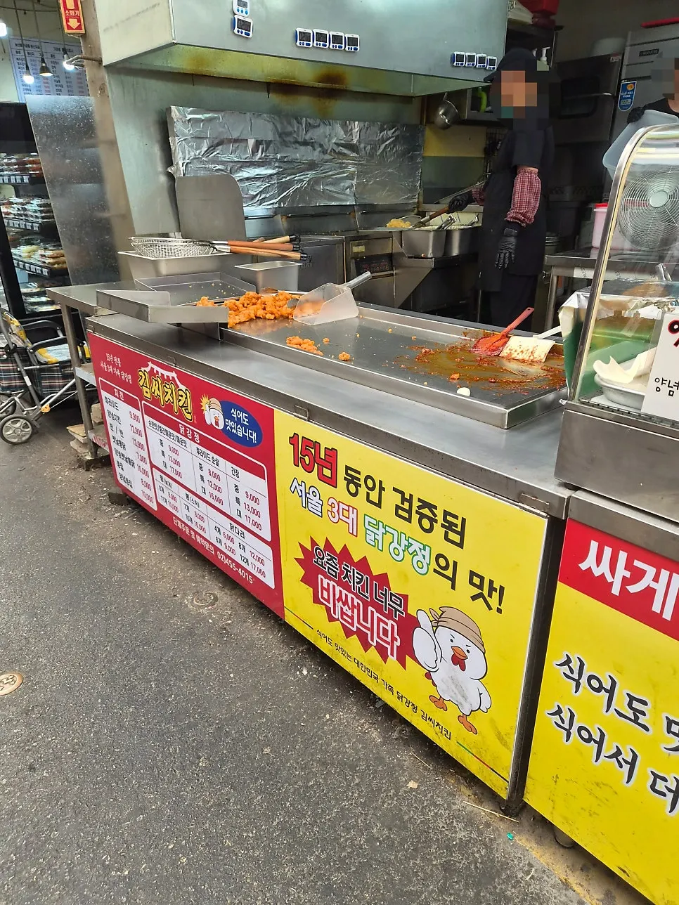 Crowd of people buying chicken in front of Mr. Kim's Chicken