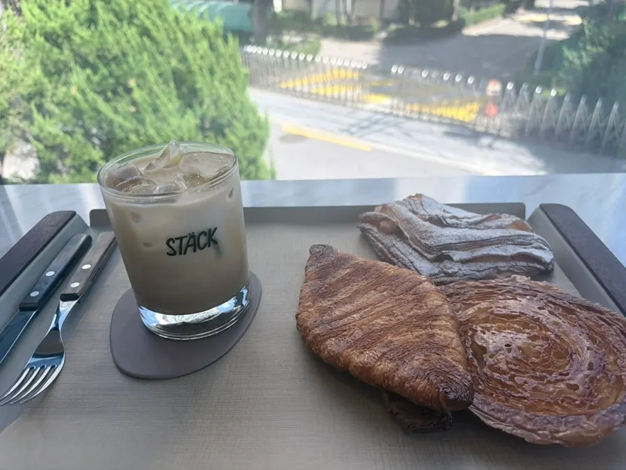 Kouign-amann and croissants displayed in the showcase