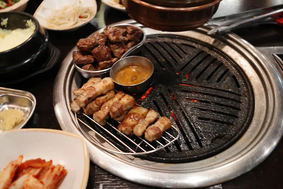 Table spread with meat and doenjang-jjigae together