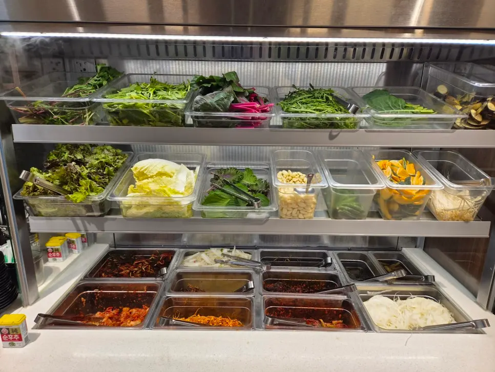 Extra vegetables and side dishes at the self-service station