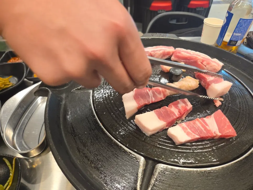Pork belly and Emperor beef ribs grilled on a pot lid
