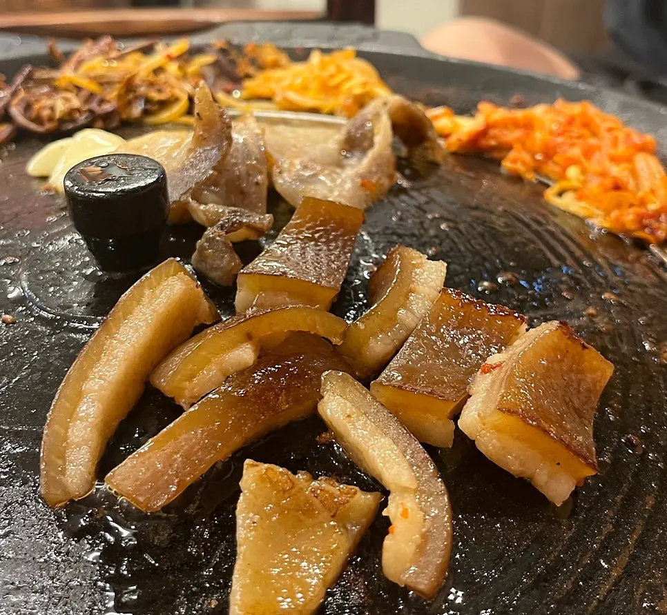 Frozen pork belly eaten wrapped in greens