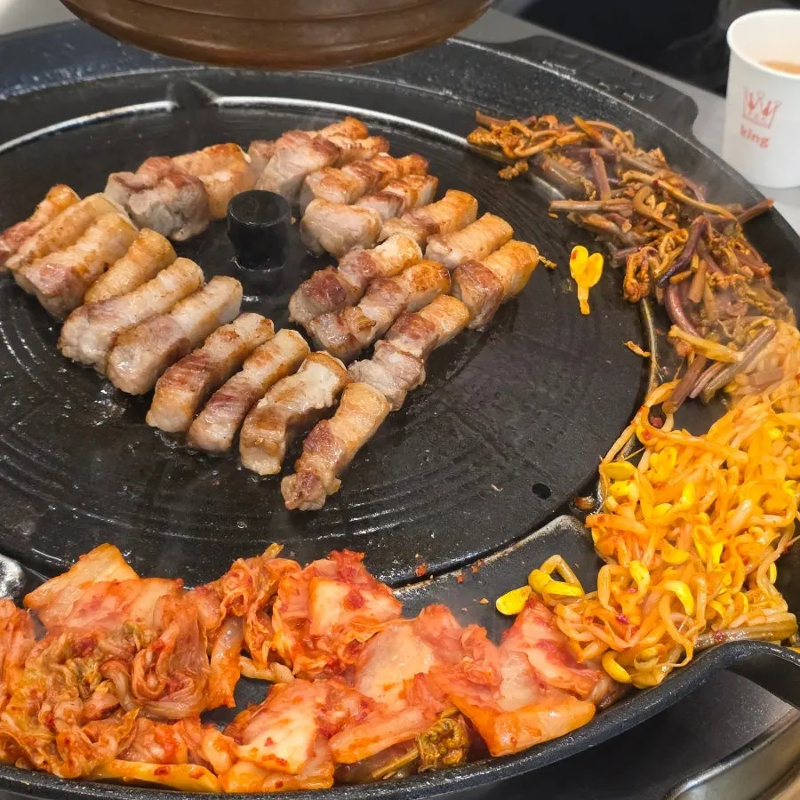 Bracken and kimchi on the pot lid