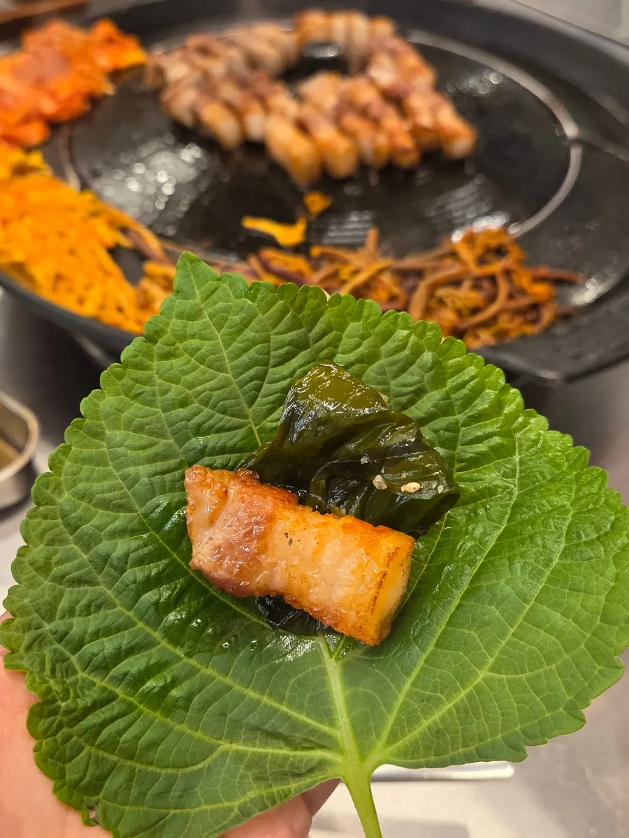 Pork belly enjoyed with wrap vegetables