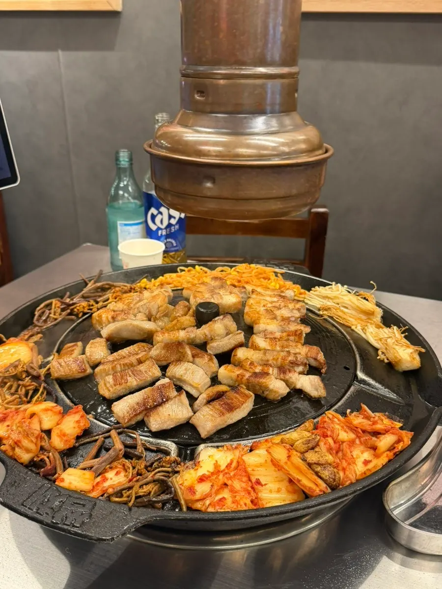 Grilled kimchi, bracken fern, and bean sprout accompaniments