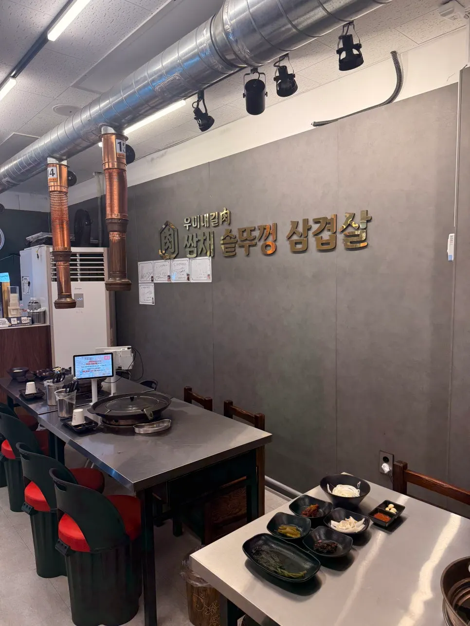Clean restaurant wall with a sign hanging on it