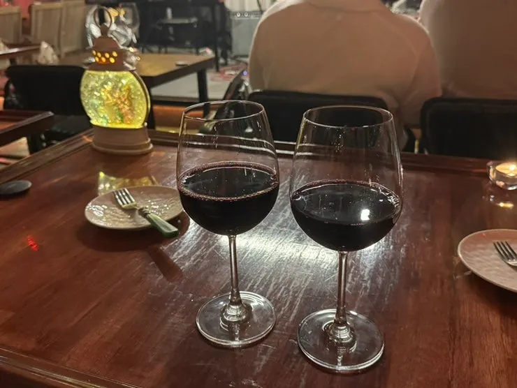 Two generously poured glasses of wine